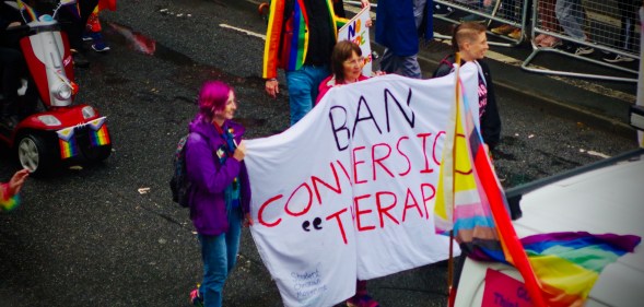 People carrying "Ban Conversion Therapy" banner at Brighton Pride Parade