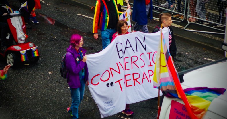 People carrying "Ban Conversion Therapy" banner at Brighton Pride Parade