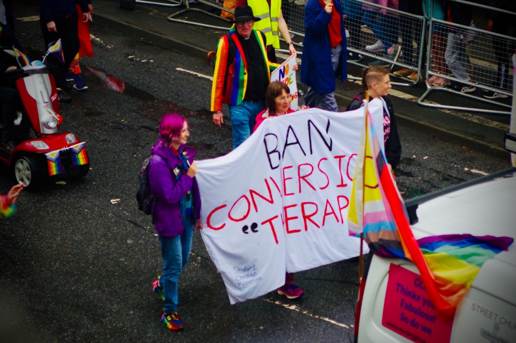 People carrying "Ban Conversion Therapy" banner at Brighton Pride Parade