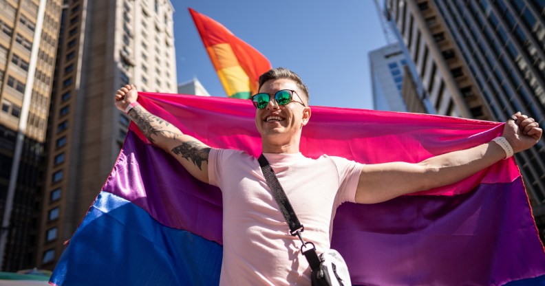 Man holding bisexual pride flag