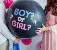 Man and woman holding a balloon with the text Boy or Girl? for a gender reveal party