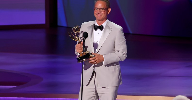 Greg Berlanti accepting the Governor's Award at the 76th Emmy's for queer representation, including the Dawson's Creek gay kiss