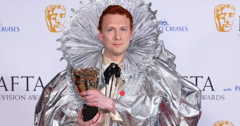 Joe Lycett holding a BAFTA award