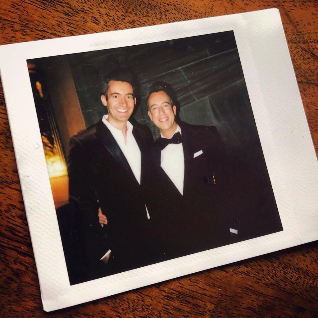 Ben Thompson and partner Andy Roche wearing suits in a polaroid pic together