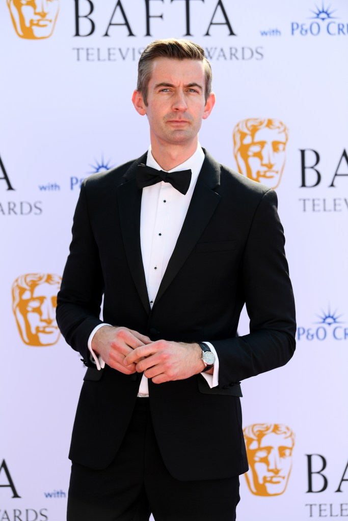 Ben Thompson attends the 2024 BAFTA Television Awards, wearing a white shirt and black suit with bowtie