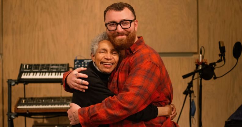 Beverly Glenn-Copeland and Sam Smith hug in a music studio