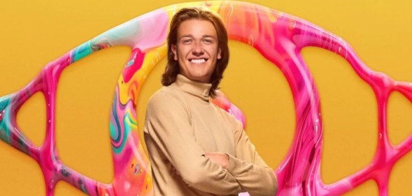 Big Brother Nathan wearing a rollneck in front of a yellow background and eye logo