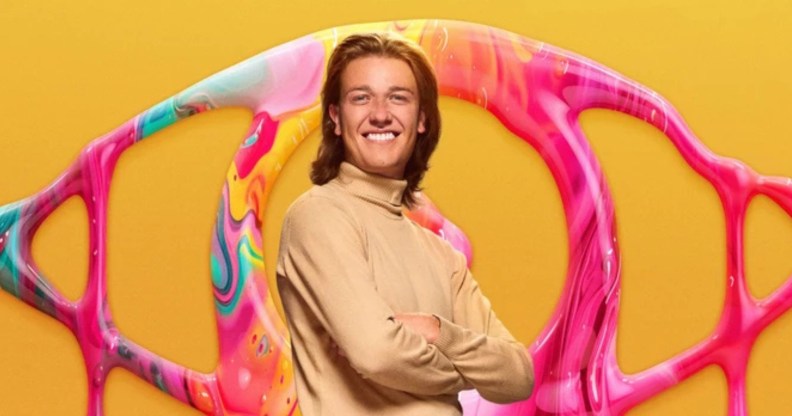 Big Brother Nathan wearing a rollneck in front of a yellow background and eye logo