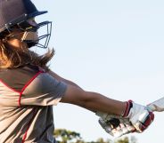 A person holding a cricket bat.