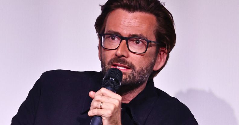 David Tennant, pictured with a microphone in his hand.