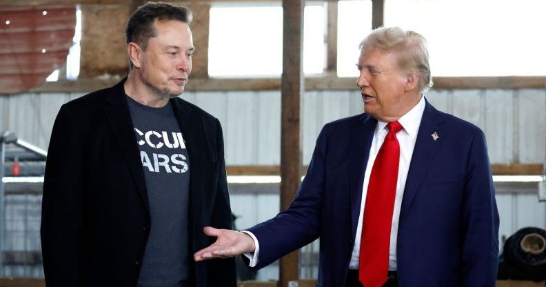 Republican presidential nominee, former President Donald Trump offers his hand to Elon Musk back stage during a campaign rally at the Butler Farm Show grounds on October 05, 2024 in Butler, Pennsylvania