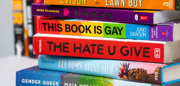 Stack of frequently-banned books in the US including Gender Queer by Maia Kobabe