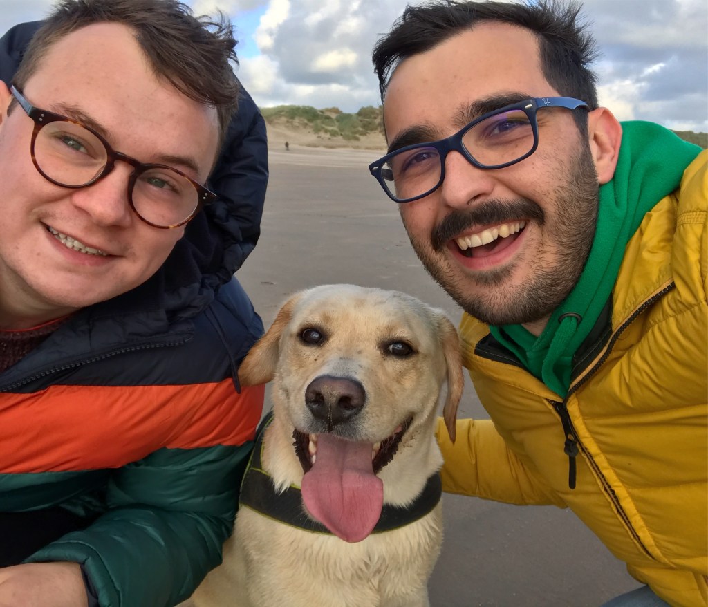 Rhys and Guto with their dog, Tudur, pictured in the middle.