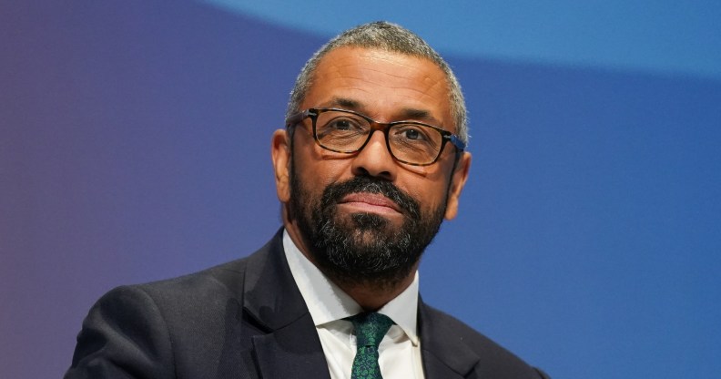 Conservative leadership contender and Shadow Home Secretary James Cleverly wearing a black suit with a green tie