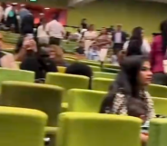 Students stage walk-out at Australian Catholic University graduation after a speech by Joseph de Bruyn