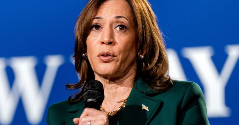 Kamala Harris speaking into a microphone.