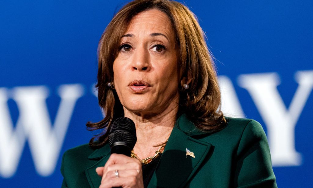 Kamala Harris speaking into a microphone.