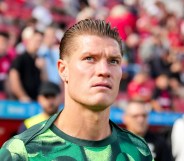 Kevin Behrens of VfL Wolfsburg walks out to warm up at a football match