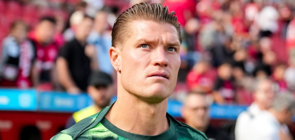 Kevin Behrens of VfL Wolfsburg walks out to warm up at a football match