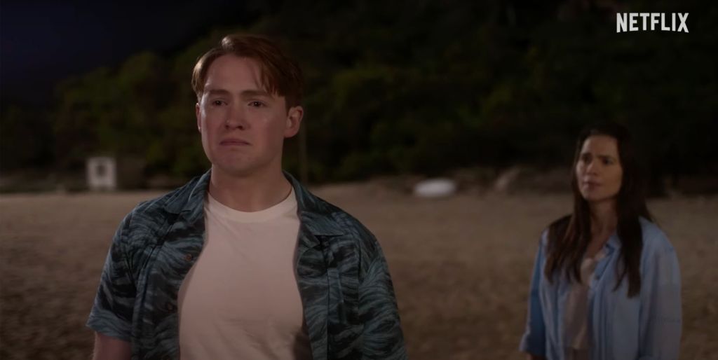 A scene from Heartstopper season three featuring Kit Connor and Hayley Atwell on a beach