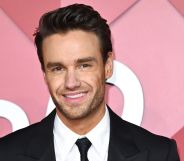 Liam Payne smiles on a red carpet in 2022.