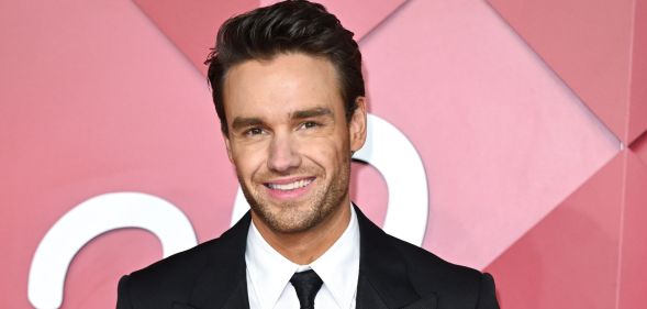 Liam Payne smiles on a red carpet in 2022.