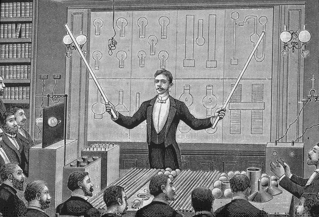 Engraving of Serbian-American inventor Nikola Tesla (1856 - 1943) 'lecturing before the French Physical Society and The International Society of Electricians, circa 1885. (Kean Collection/Getty Images)