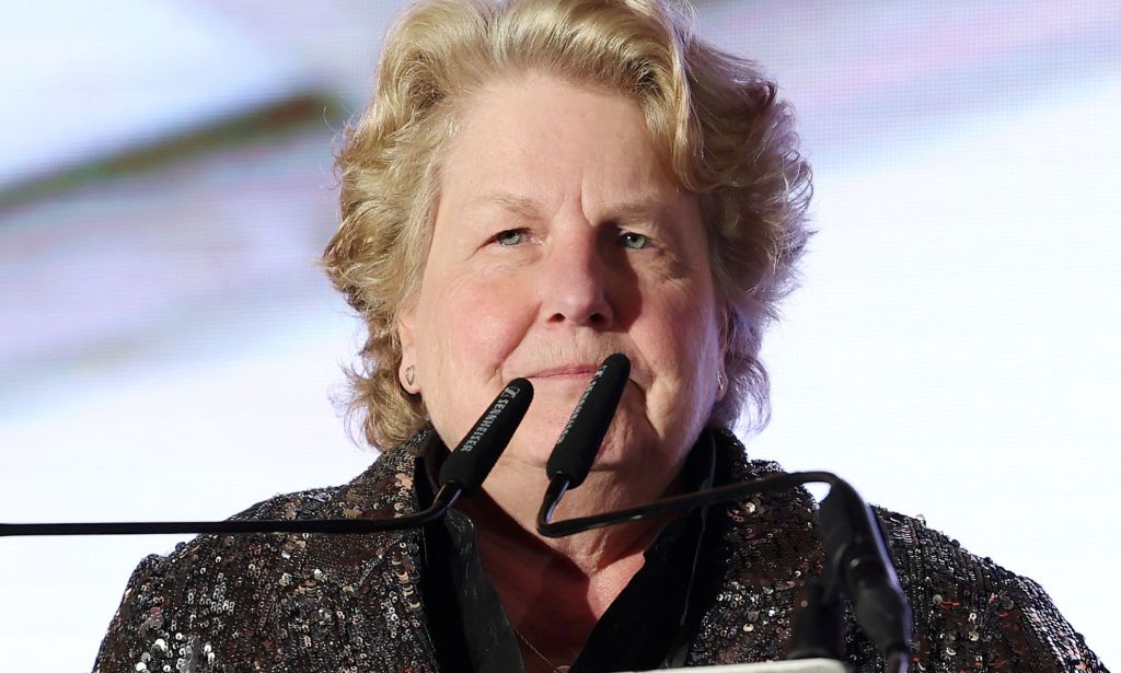 Sandi Toksvig speaking on a podium.