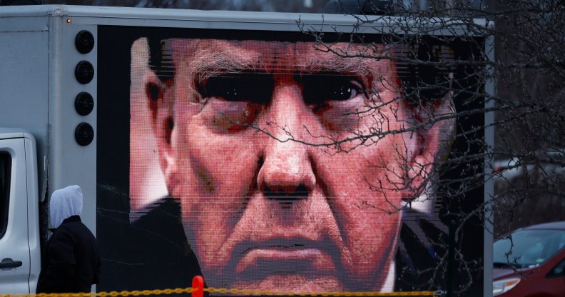 A digital billboard truck sponsored by The Lincoln Project tries to park outside a campaign rally with Republican presidential candidate and former President Donald Trump