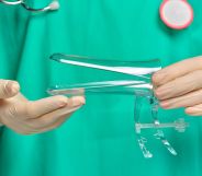 Stock image of a doctor holding a speculum to illustrate article on smear test