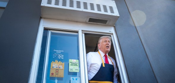 Donald Trump leaning out of the drive-thru window at McDonald's in Pennsylvania