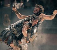 Fight scene from Gladiator II, Paul Mescal is seen tackling Pedro Pascal in the arena