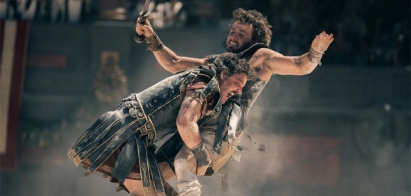 Fight scene from Gladiator II, Paul Mescal is seen tackling Pedro Pascal in the arena