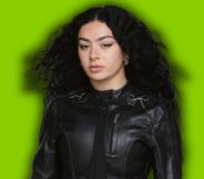 Charli XCX against a brat green background