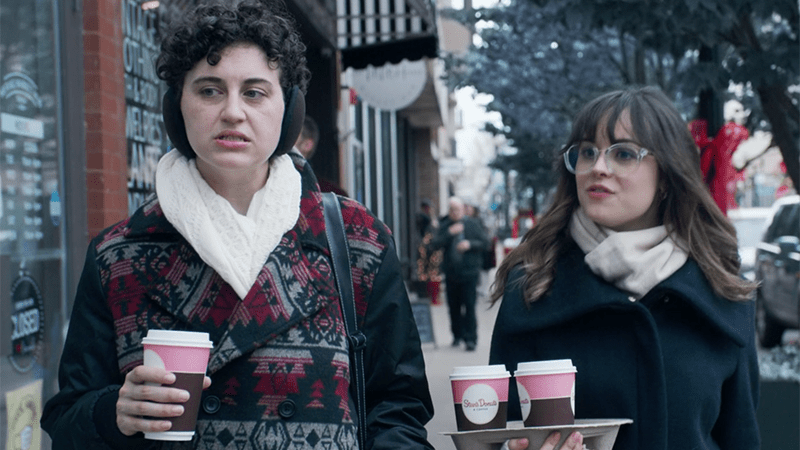 Christmas is Canceled: two women walking in the winter with takeaway drinks.