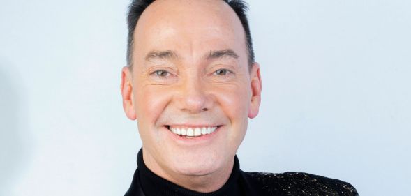 A portrait of Craig Revel Horwood smiling.