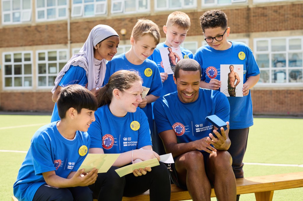 YST Athlete mentors Steve Frew, Ama Agbeze, and Michael Gunning with pupils at the Oasis Blakenhale Junior School. 