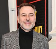 David Walliams outside a London theatre in february 2024 smiling