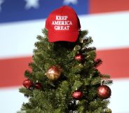 Trump Store Christmas range - Christmas MAGA hat sat atop a Christmas tree