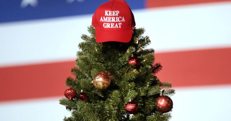 Trump Store Christmas range - Christmas MAGA hat sat atop a Christmas tree