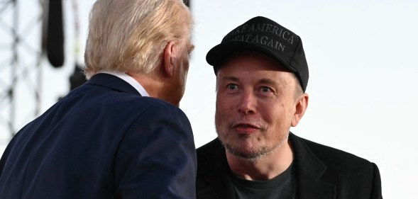 Tesla CEO Elon Musk (R) joins former US President and Republican presidential candidate Donald Trump during a campaign rally at site of his first assassination attempt in Butler, Pennsylvania on October 5, 2024. (Photo by Jim WATSON / AFP)Donald Trump reportedly can't get rid of Elon Musk. (Getty)