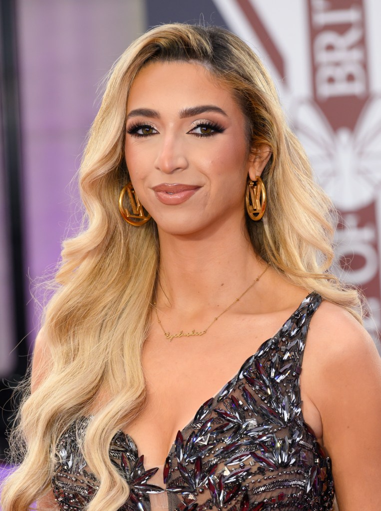 GK Barry attends The Pride of Britain Awards in a silver floral gown