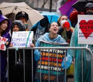 Pro abortion rights activists hold placards during the annual anti-abortion demonstration in New York City, on March 23, 2024. (Photo by Kena Betancur / AFP)