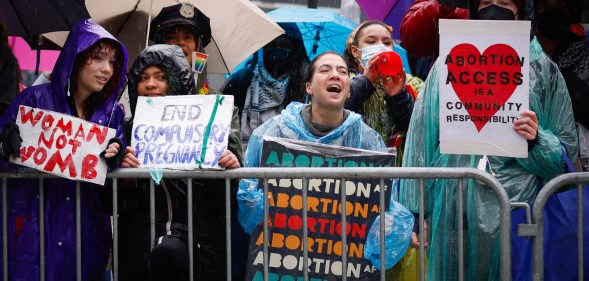 Pro abortion rights activists hold placards during the annual anti-abortion demonstration in New York City, on March 23, 2024. (Photo by Kena Betancur / AFP)