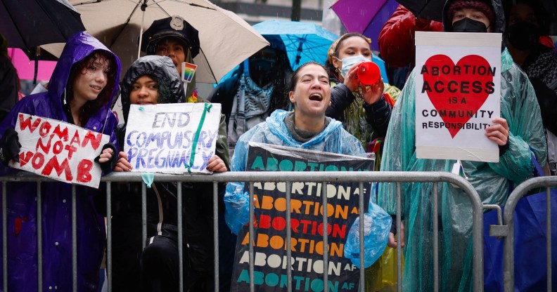 Pro abortion rights activists hold placards during the annual anti-abortion demonstration in New York City, on March 23, 2024. (Photo by Kena Betancur / AFP)