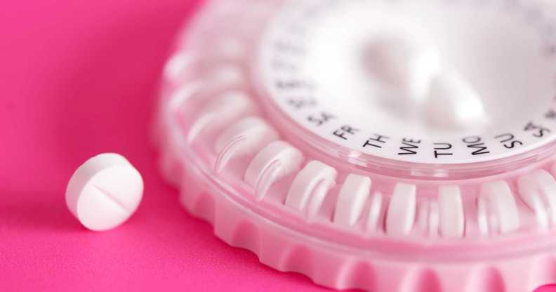 HRT pill next to pill dispenser