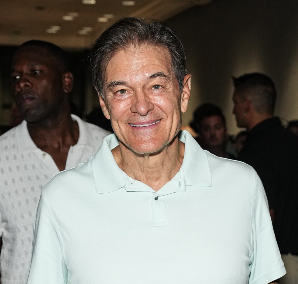 Mehmet Oz at the 40/40 Club popup inside Fanatics Fest NYC, wearing a white polo top