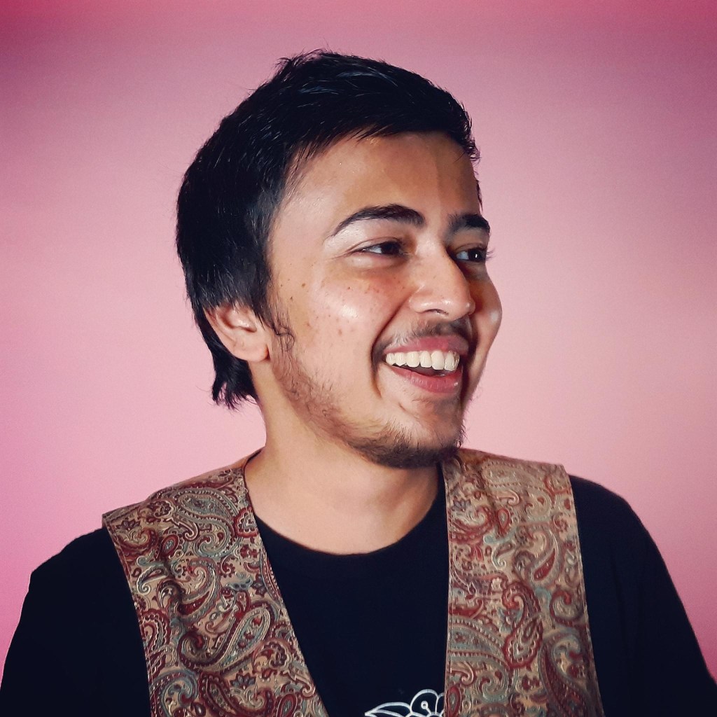 Trans-masc writer Mikail Khan. 