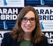 Sarah McBride smiles directly at the camera.