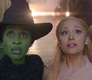 Cynthia Erivo as the green-skinned Elphaba and Ariana Grande as the pink-loving Glinda looking beyond the camera.